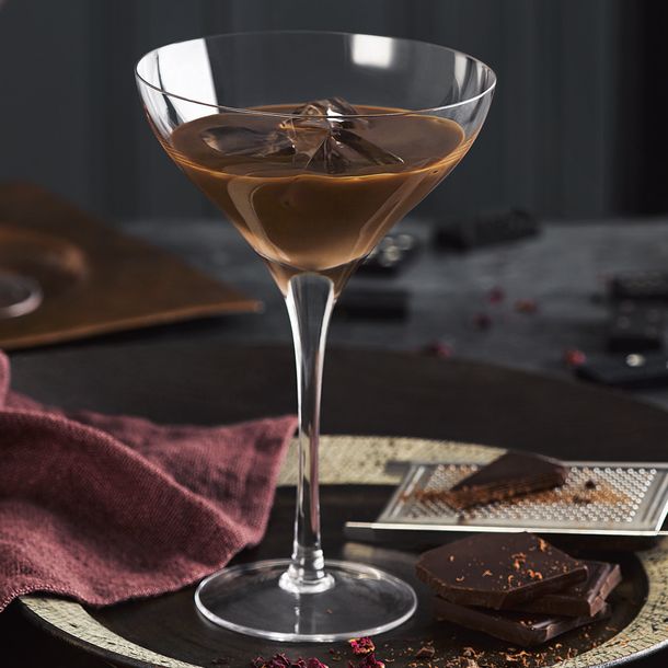 A Baileys Chocolat Luxe served in stemware with dark chocolate shavings