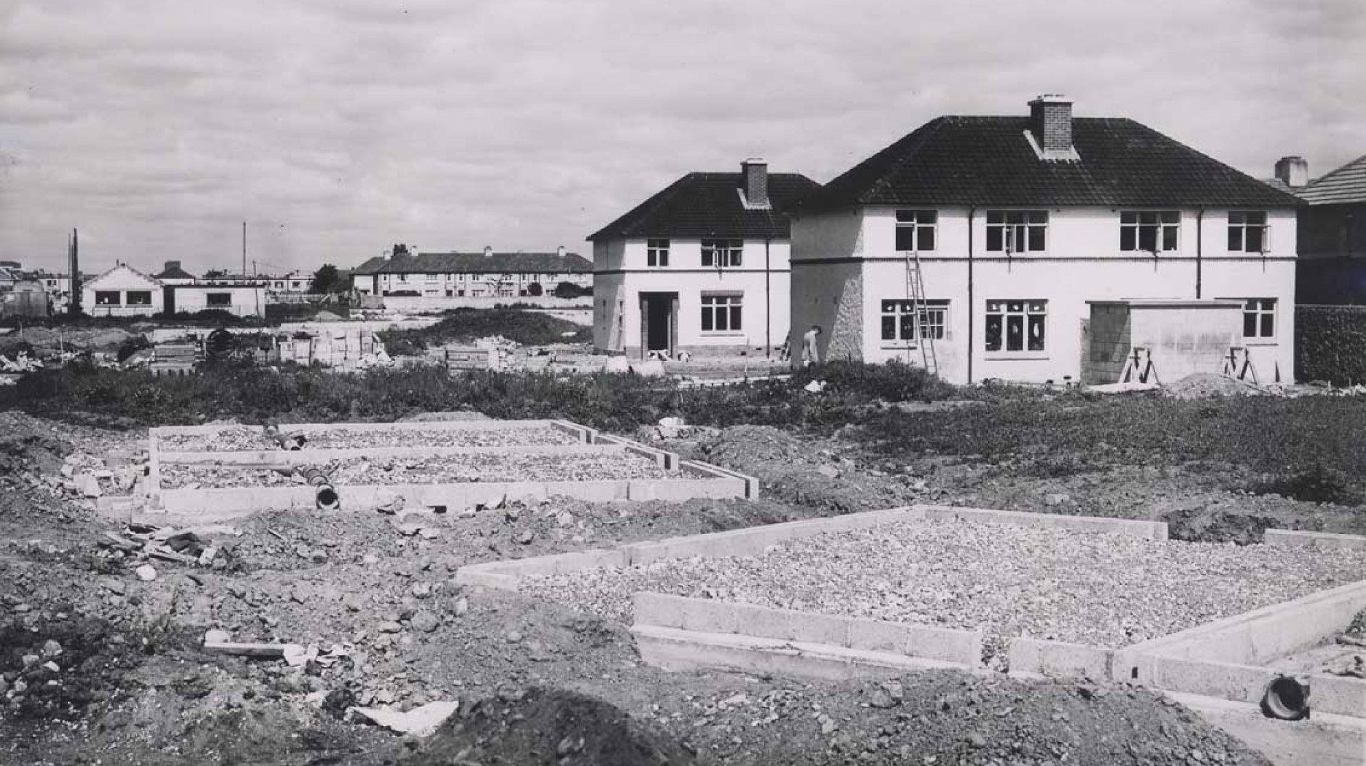 Black and white photograph of a house under construction in the Terenure housing estate, 1949