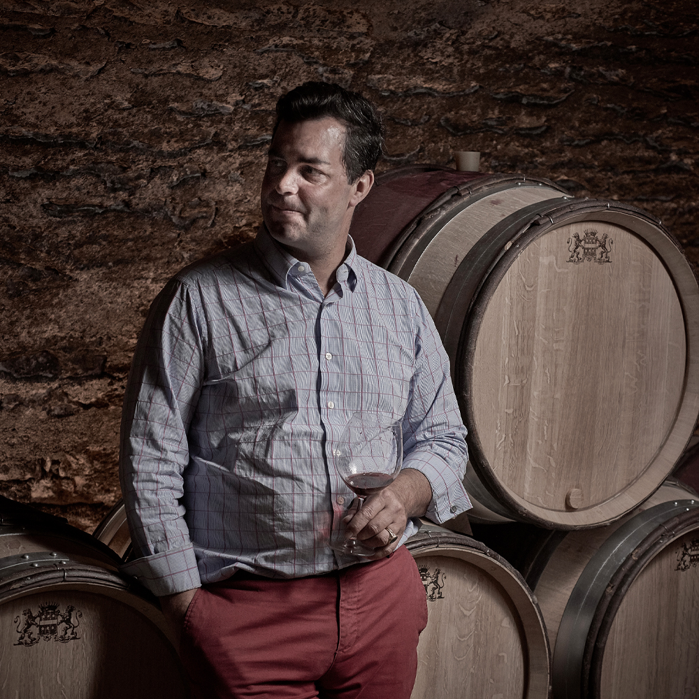 Liger-Belair in cellar with barrels