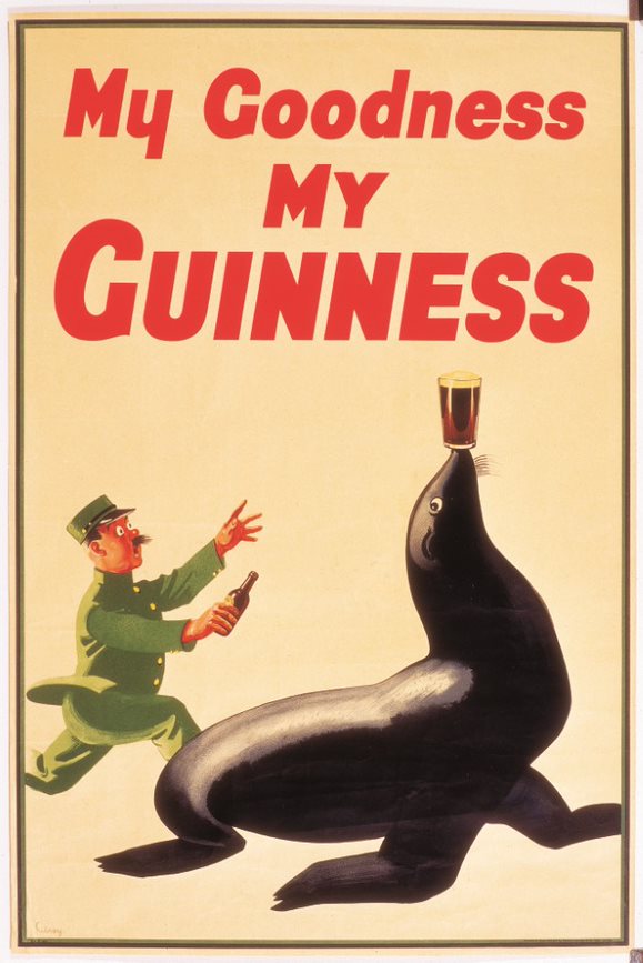 John Gilroy poster of the zookeeper character chasing a sealion, caption “My Goodness, My Guinness”. 