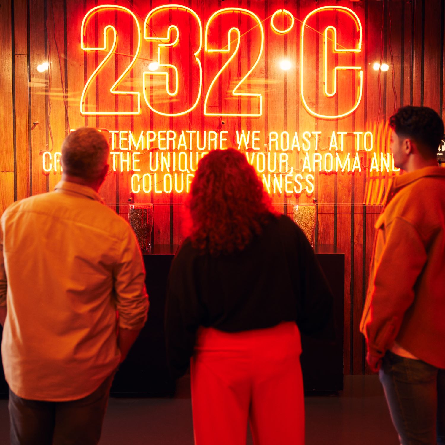 Visitors reading signage about the correct temperature to roast the barley in order to create the unique flavour, aroma and colour of Guinness