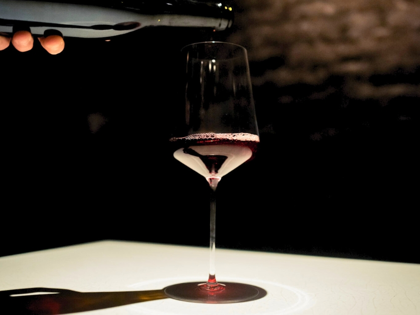 Red Burgundy being poured into a glass