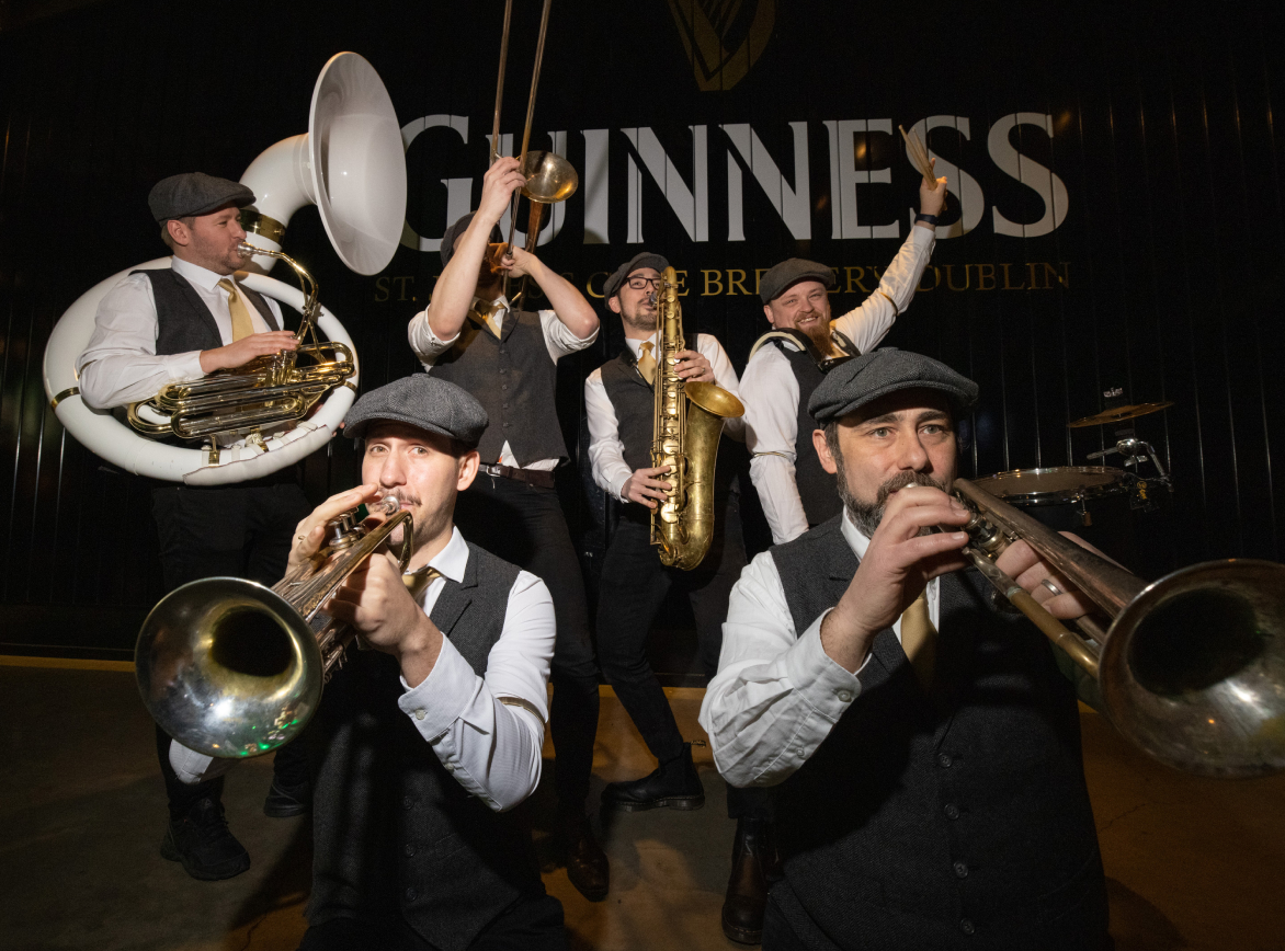 A brass band with their instruments performing during Saint Patrick’s festival at the Guinness Storehouse